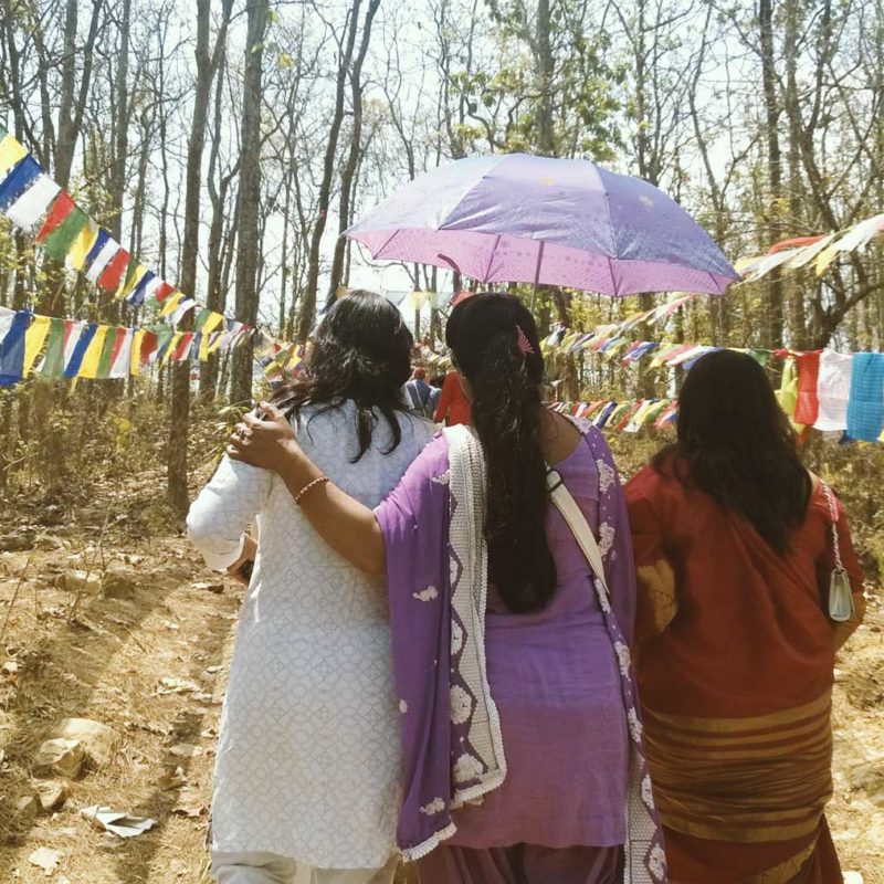 People in Nepal walking on a forest